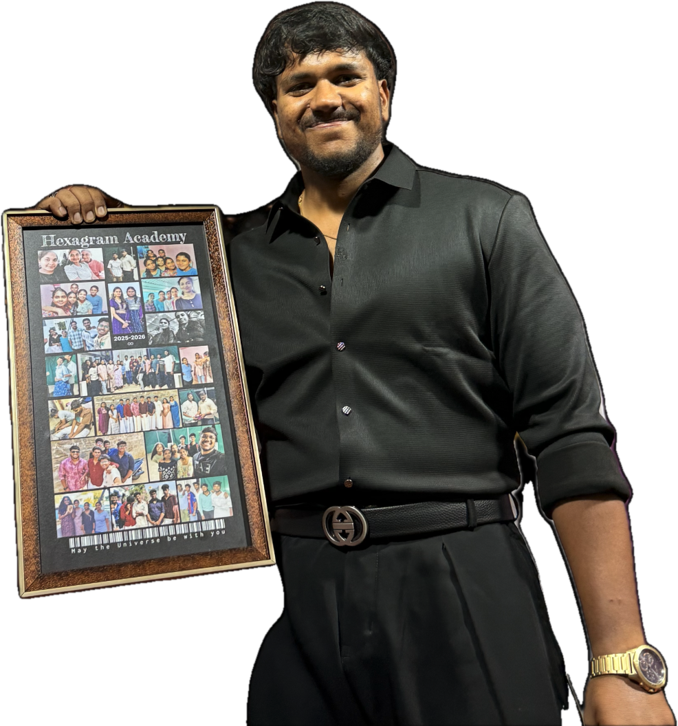 Sathya Narayana, Founder of Hexagram Academy, holding a framed collage of student achievements